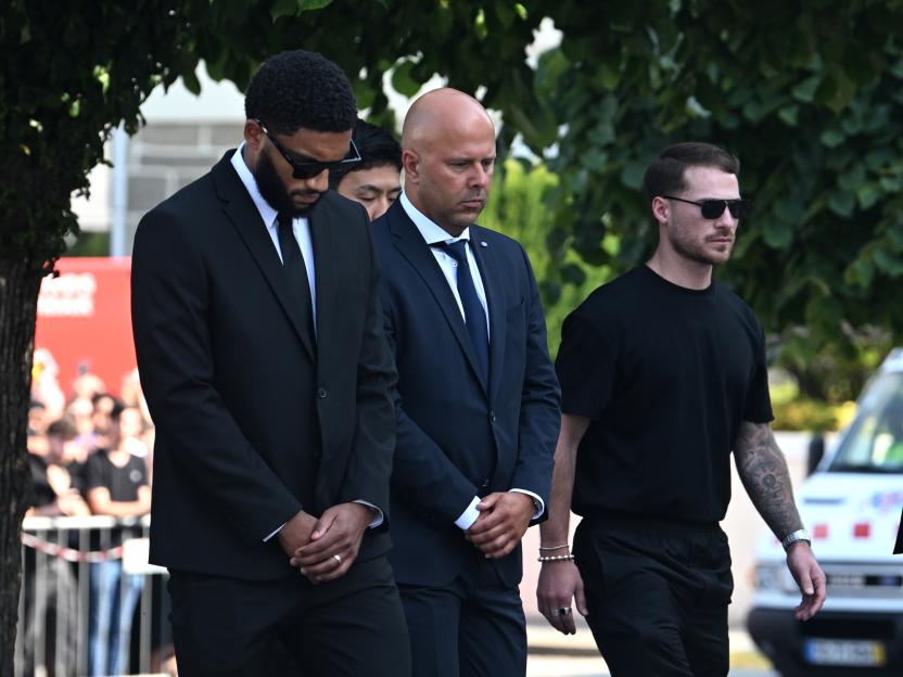 Joe Gomez and Arne Slot at a funeral.