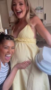 Photo of a pregnant woman at her baby shower.