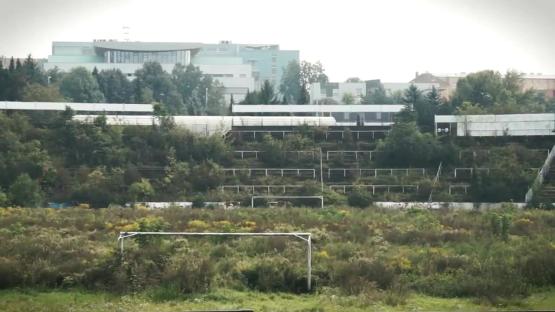 Overgrown abandoned 50,000-seat stadium.