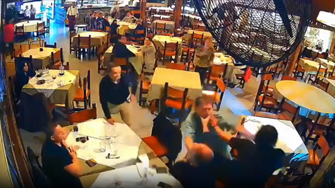 Fight breaking out in a restaurant.