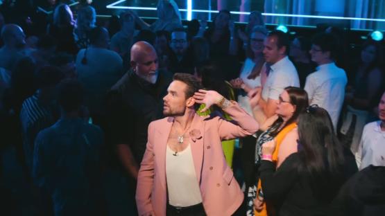 Liam Payne, judge on the Netflix reality show *Building the Band*, interacting with the audience.