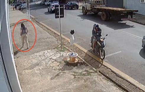 CCTV footage of a woman jumping from a moving Uber and running away.