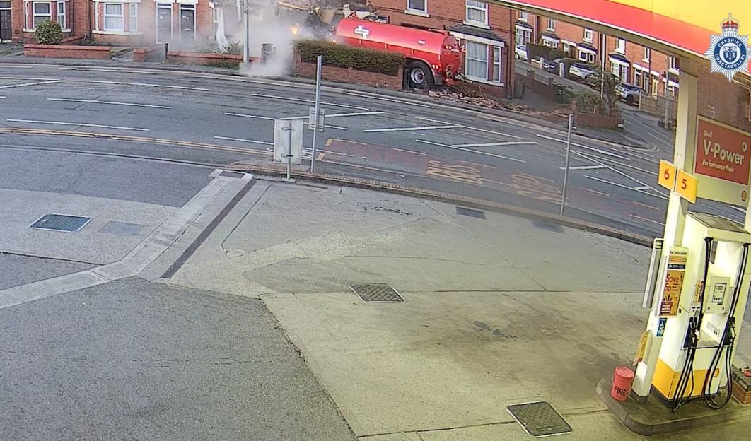 Smoke billowing from a crashed tractor.