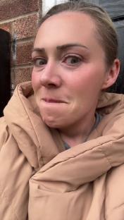 Close-up of a woman appearing distressed.