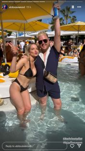 Screenshot of two people in a pool at a party.
