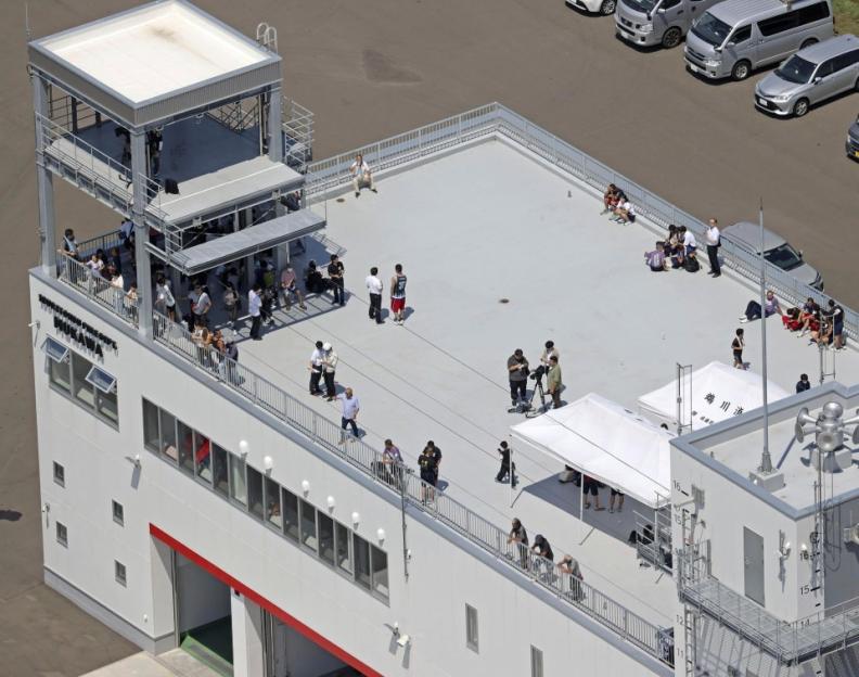 Aerial view of people on a rooftop.