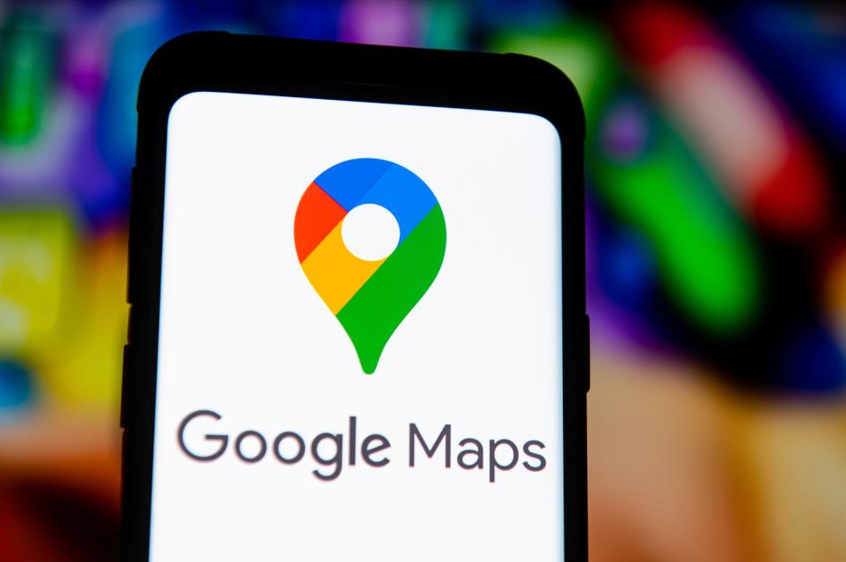 Google Maps logo on a smartphone screen.