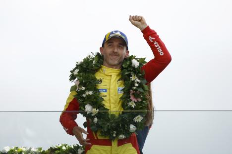 Robert Kubica celebrates winning the 24 Hours of Le Mans.
