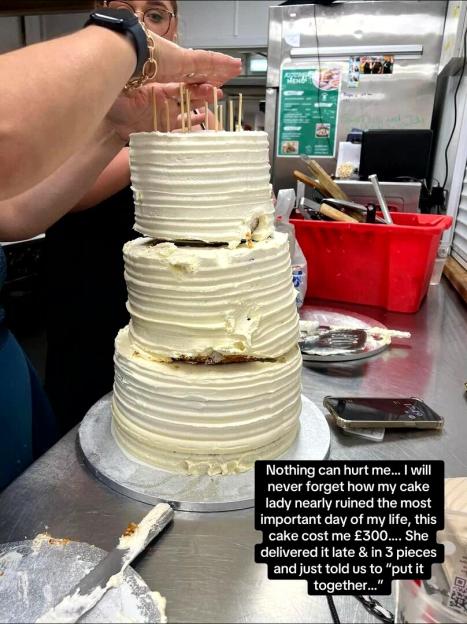 A three-tiered wedding cake delivered in three separate pieces, being assembled with toothpicks.