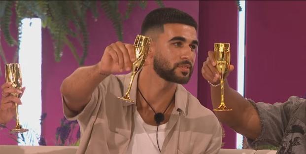 Man toasting with golden champagne flutes.