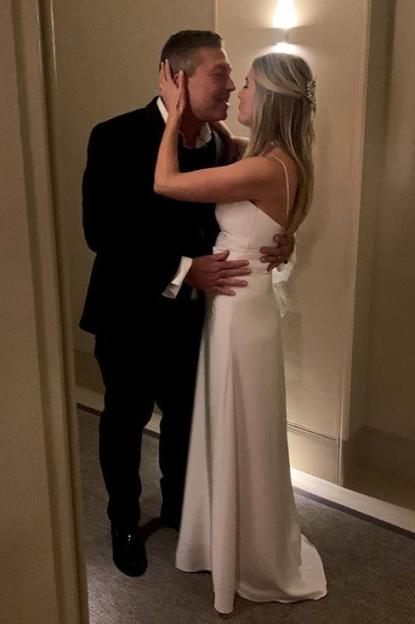 Bride and groom embracing.