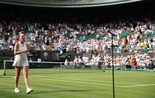 LONDON, ENGLAND - JULY 01: Petra Kvitova of Czechia walks towards the microphone to speak in an interview ahead of her retirement, following her defeat against Emma Navarro of United States during the Ladies' Singles first round match on day two of The Championships Wimbledon 2025 at All England Lawn Tennis and Croquet Club on July 01, 2025 in London, England. (Photo by Clive Brunskill/Getty Images)