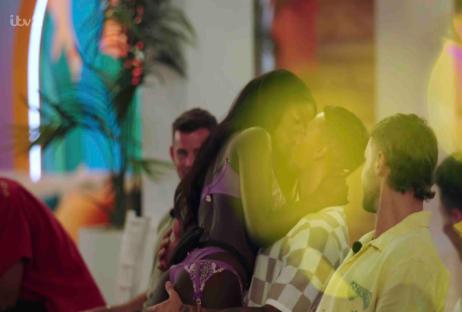 Screenshot of Love Island contestants kissing.