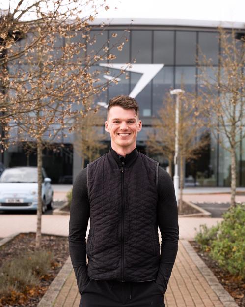 Ben Francis, Gymshark founder, smiling outdoors.