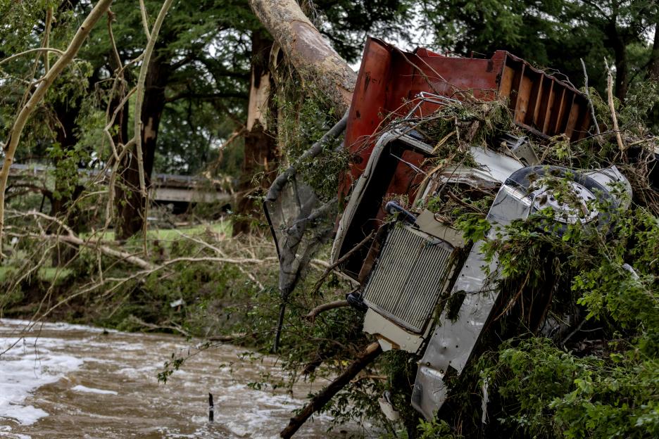 Truck impaled on tree after flash flooding.
