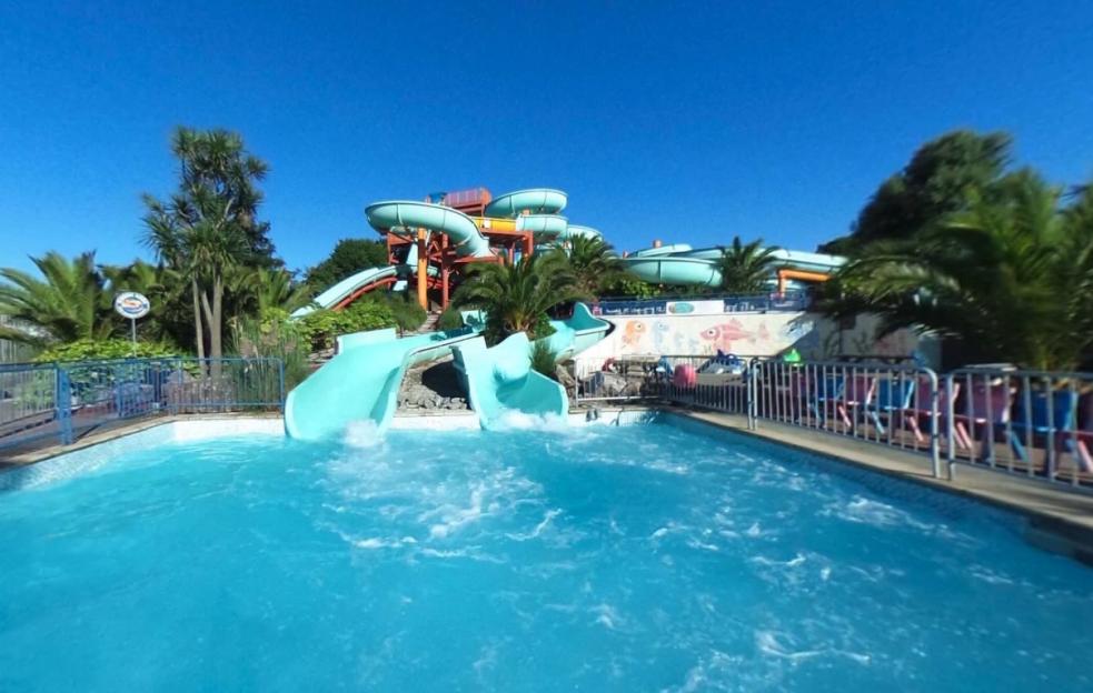 Water park slides emptying into a pool.