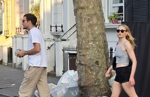 Sophie Turner and Peregrine Pearson leaving a London restaurant.