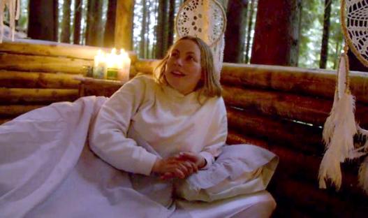 Charlotte Church smiling outdoors.