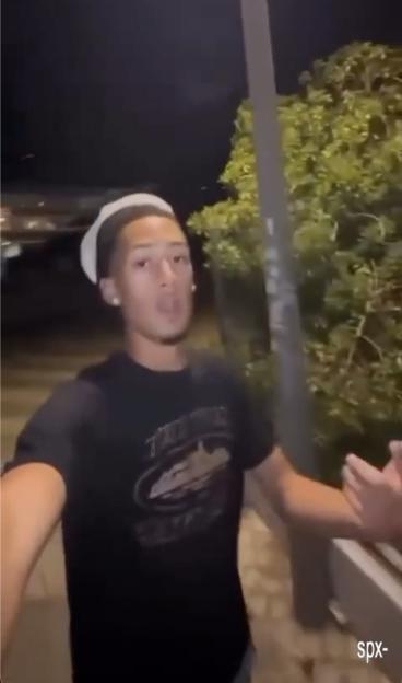 A young man films himself, seemingly involved in an assault.