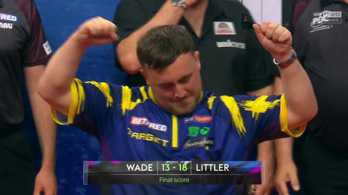 A darts player celebrates a victory, the final score is shown as Wade 13-18 Littler.