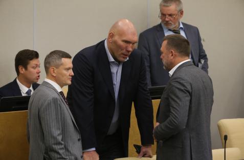 Nikolay Valuev, Russian State Duma Deputy, smiles before a vote on annexing four Ukrainian regions.