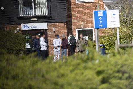 Immigrants outside an Ibis Budget hotel in Bishop's Stortford.