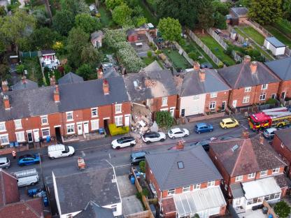 Aerial view of a house damaged by a gas explosion.