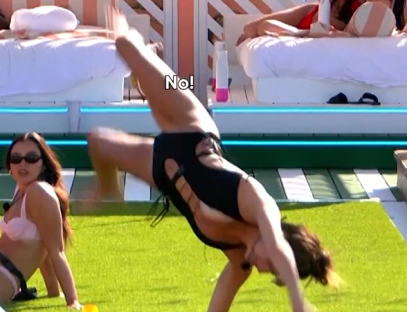 Woman falling during a handstand.