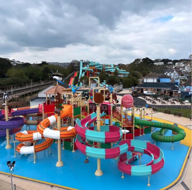 Aerial view of Splashdown Quaywest water park with colorful slides and a play area.