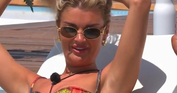 Woman in sunglasses sunbathing.