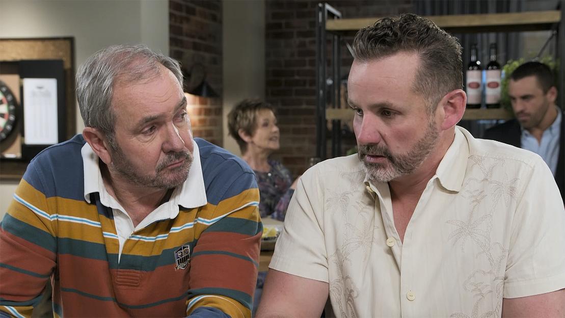 Two men talking.