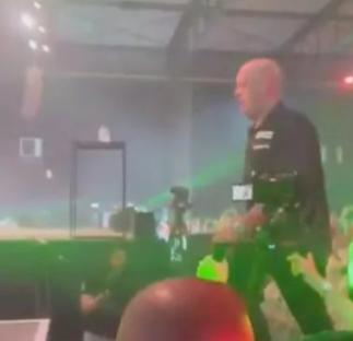 Man on stage at a concert.