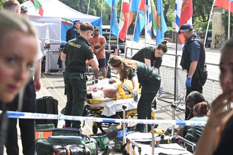 Paramedics attending to a protester injured outside the Iranian embassy.