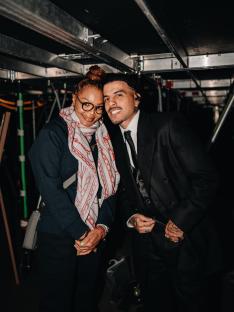 Rauw Alejandro and Janet Jackson backstage at a concert.
