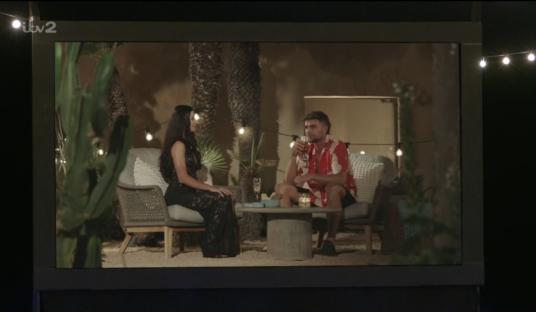 Screenshot of a Love Island episode showing a couple on a date.