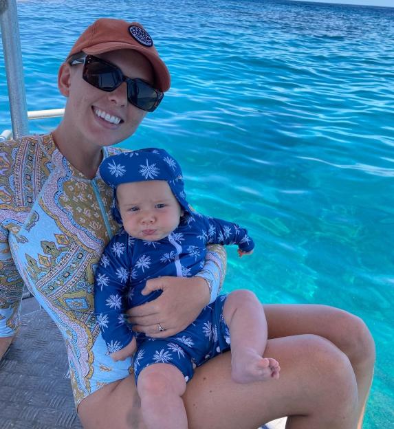 Ruby Holmes with son on a remote island. Supplied