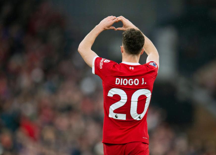 Diogo Jota of Liverpool making a heart shape with his hands after scoring a goal.