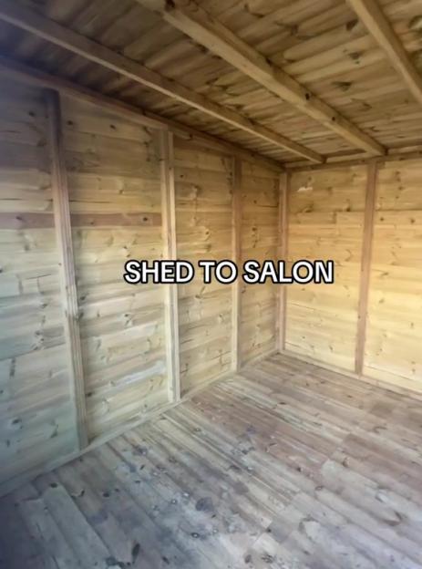 Empty wooden shed interior.