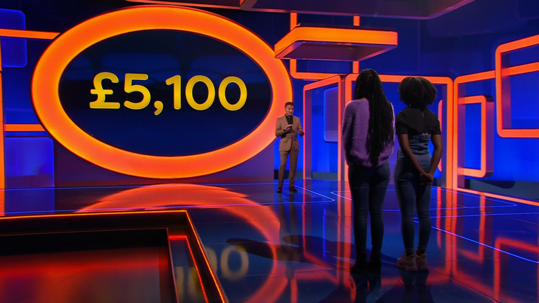 Two contestants on a game show, £5,100 displayed.