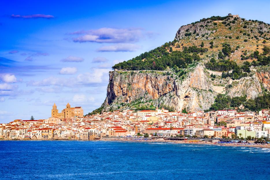 Cefalù, Sicily: coastal city and medieval cathedral on a rocky hillside overlooking the Ligurian Sea.