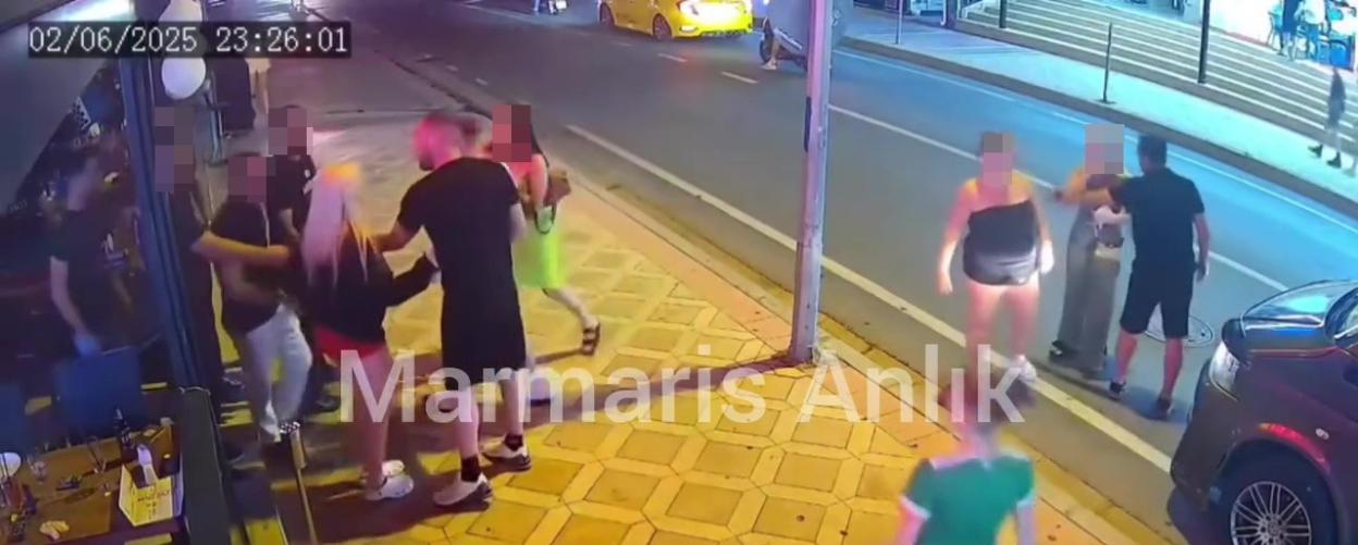 Security footage of a fight outside a bar.