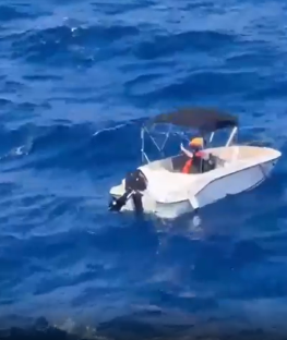 Small motorboat on the ocean.