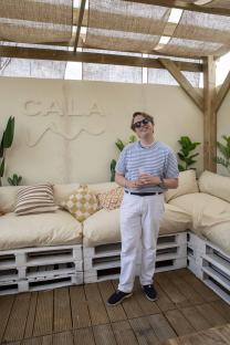 Person standing in a Cala lounge area at a park.