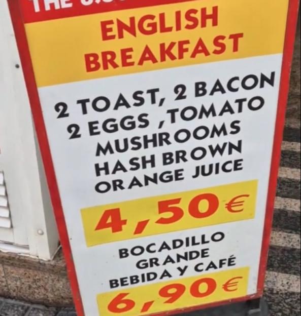 Menu board advertising a full English breakfast for â¬4.50 and a larger meal for â¬6.90.
