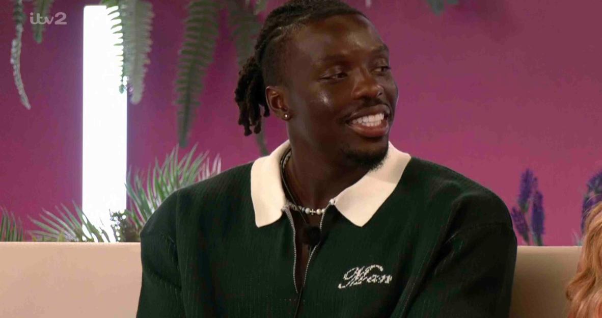 Dejon from Love Island smiling.