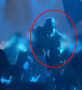 Conor McGregor punching a man in a nightclub.