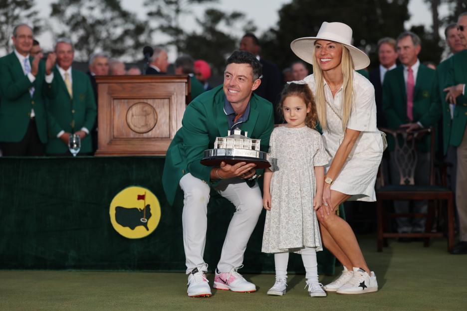Rory McIlroy with his family and the Masters trophy.
