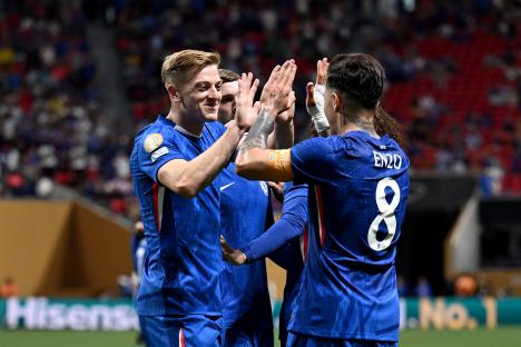 Chelsea FC players celebrating a goal.