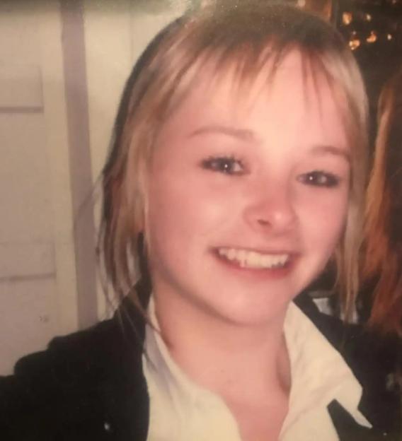 Photo of a young woman smiling.
