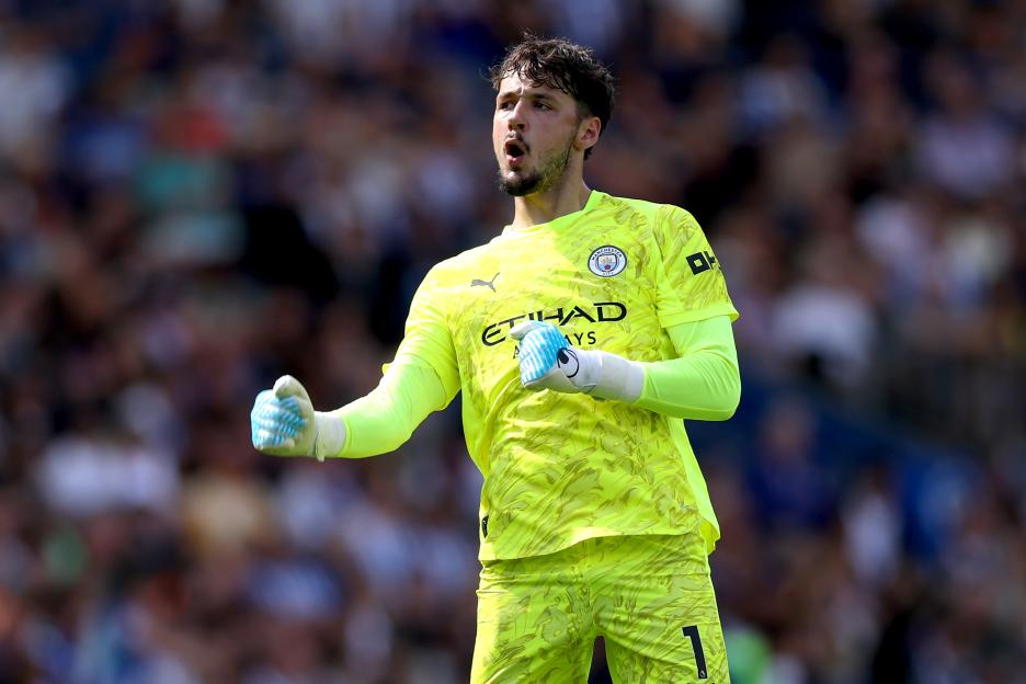 James Trafford celebrating Manchester City's first goal.
